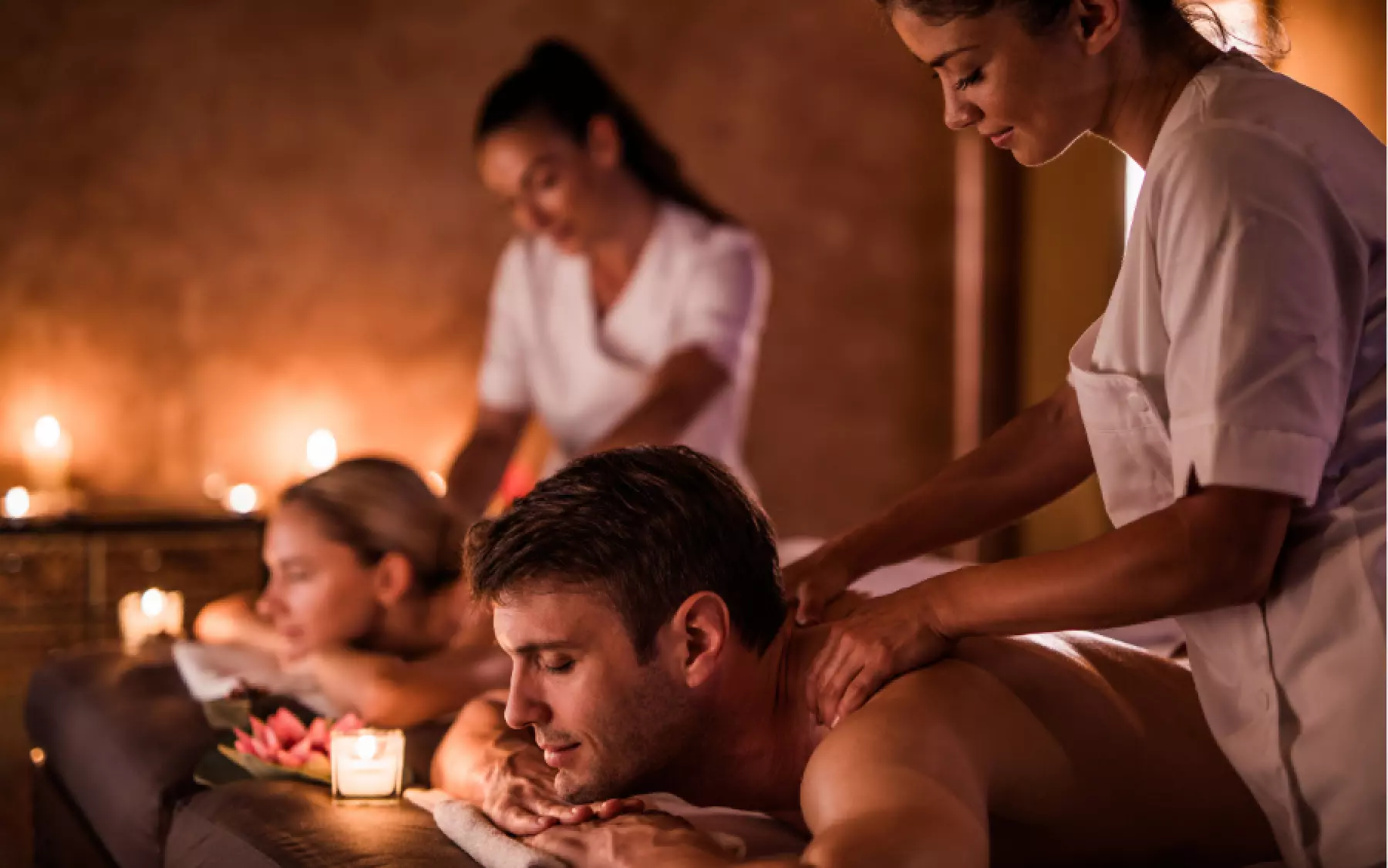 Couple enjoying massage at a spa