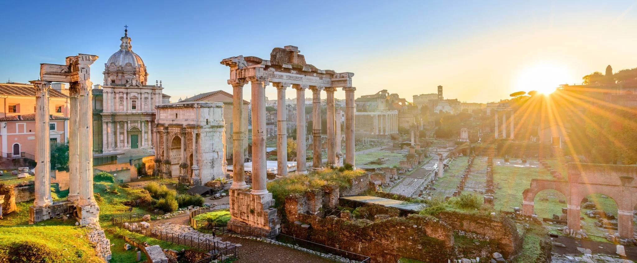 Roman Forum at sunset, Rome – one of the must-visit historic landmarks and ancient architecture on an Italian vacation.